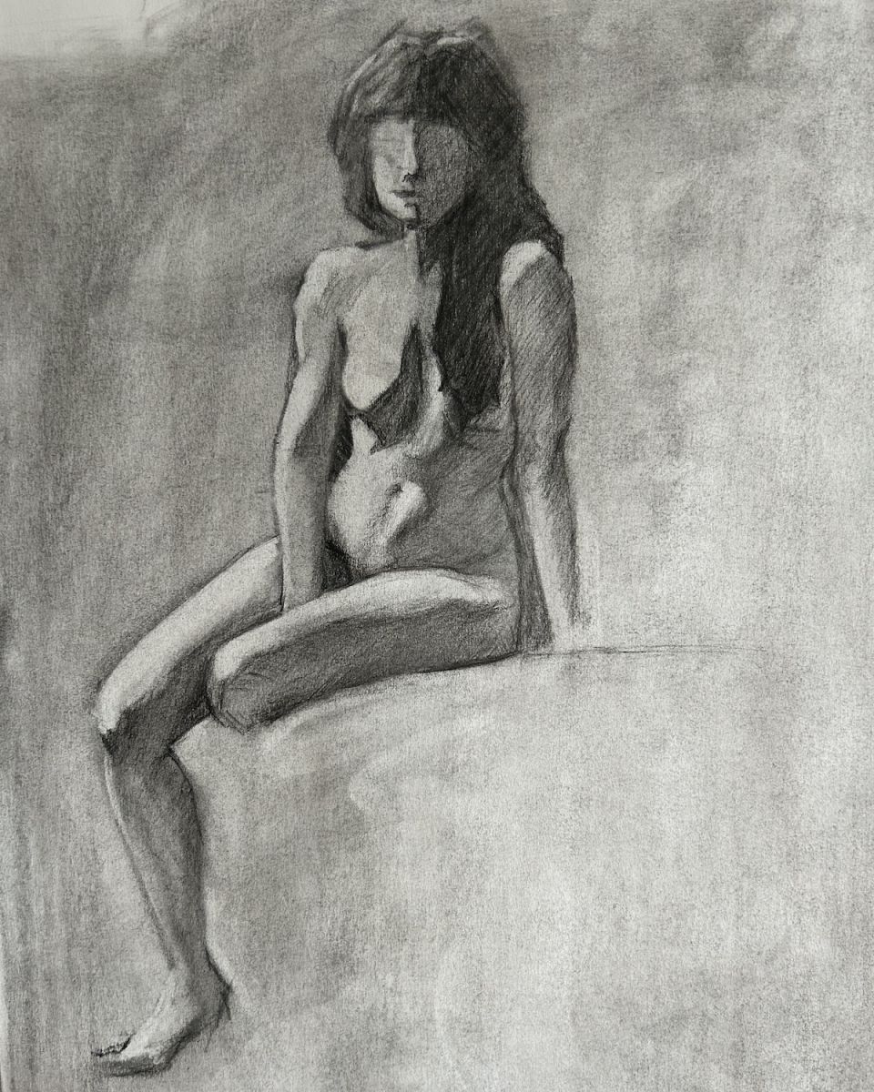 A sketch of a nude woman gracefully perched on a rock, embodying natural beauty and serenity in a tranquil setting